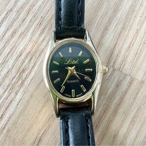 Ltd ladies black dial oval dress watch NEW BATTERY